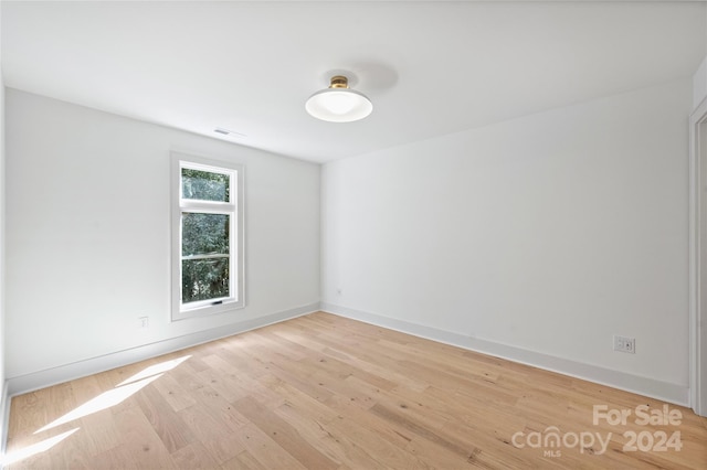 spare room with light wood-type flooring