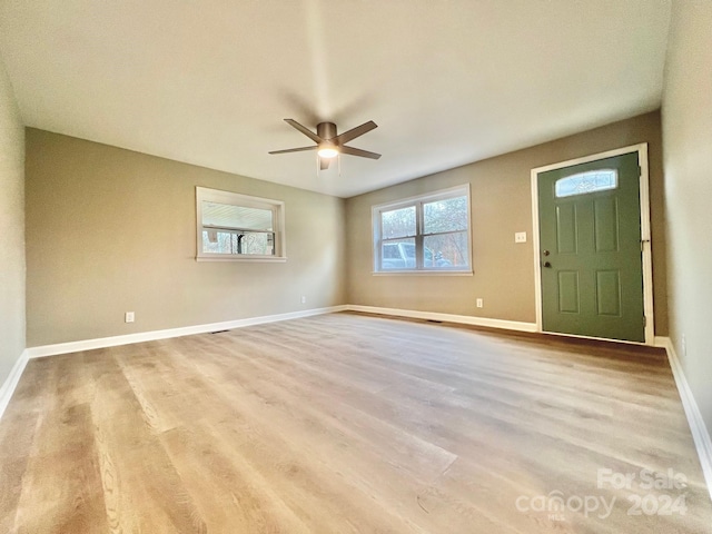 entryway with light hardwood / wood-style floors and ceiling fan