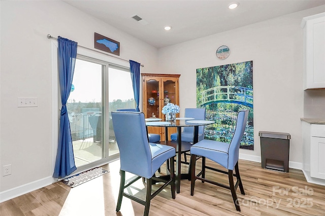 dining space featuring light hardwood / wood-style floors