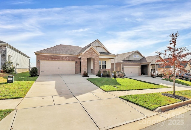 craftsman inspired home with a garage and a front lawn