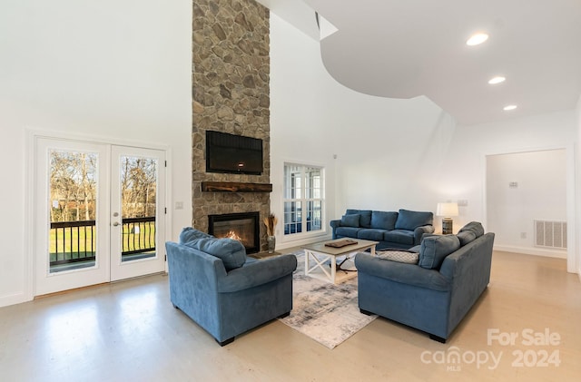 living room with a fireplace and french doors