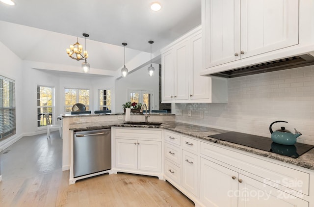 kitchen featuring dishwasher, sink, light hardwood / wood-style flooring, black electric cooktop, and decorative light fixtures