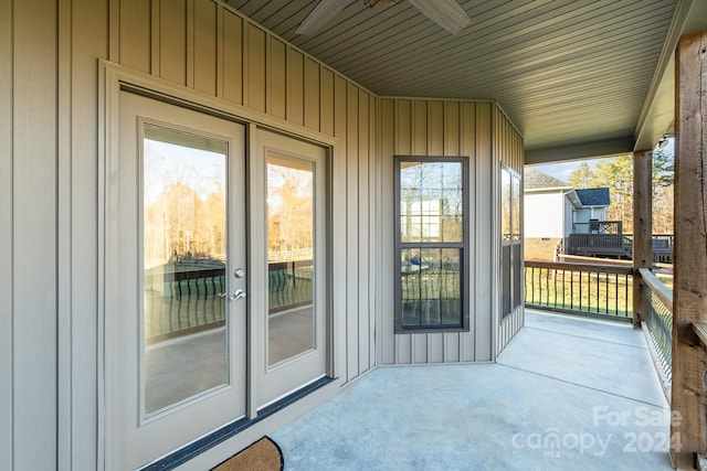 exterior space with a porch and ceiling fan