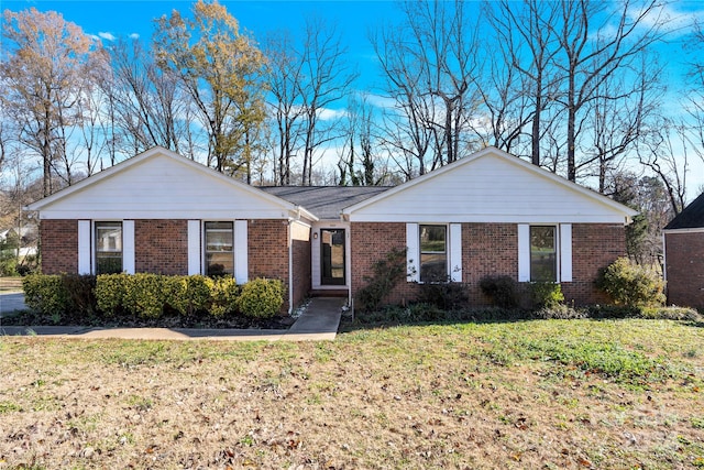 ranch-style home with a front yard