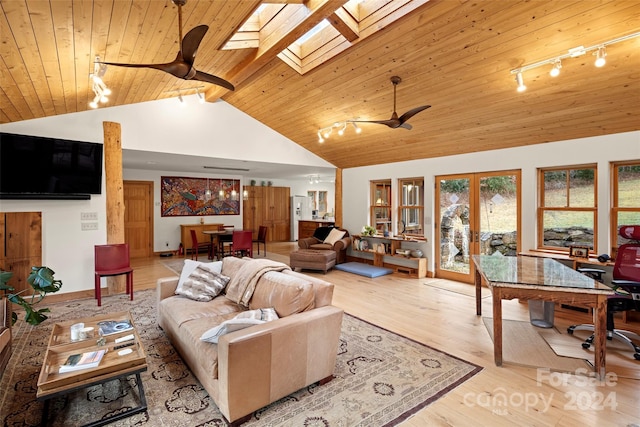 living room featuring french doors, a skylight, light hardwood / wood-style flooring, and ceiling fan