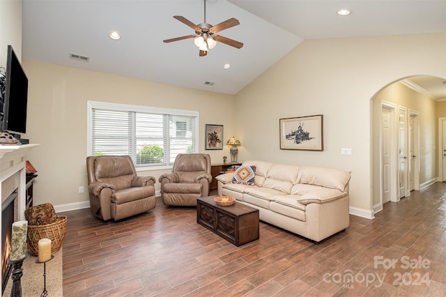 living room with ceiling fan, crown molding, high vaulted ceiling, and dark hardwood / wood-style floors