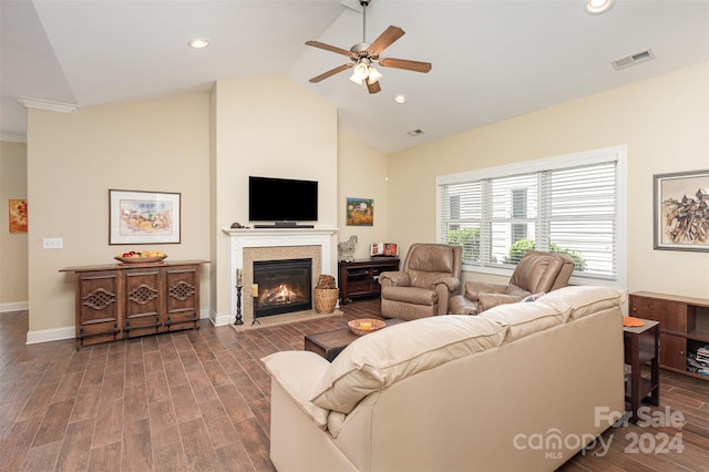 living room featuring dark hardwood / wood-style floors, ceiling fan, and high vaulted ceiling