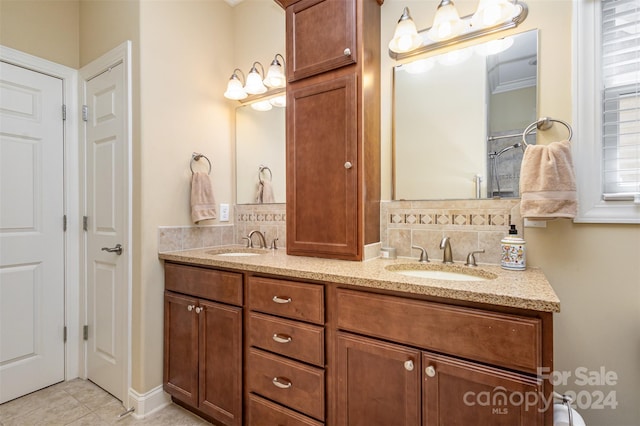 bathroom with tile patterned flooring, vanity, and ornamental molding