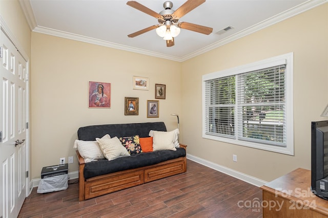 living area with ceiling fan, crown molding, and dark wood-type flooring