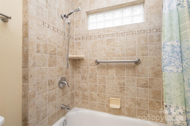 bathroom with shower / tub combo with curtain