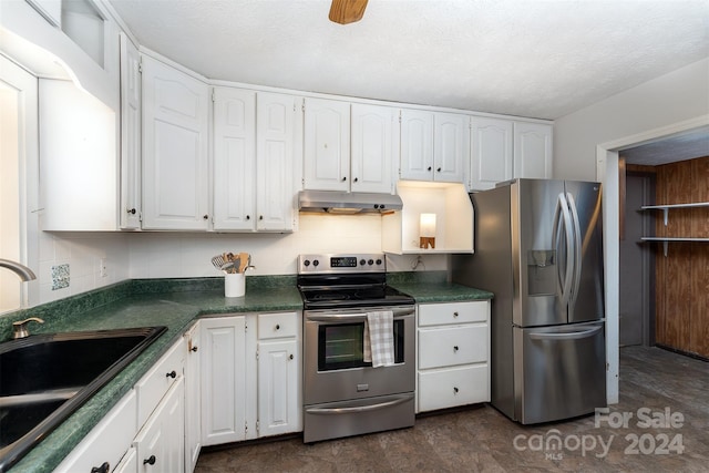 kitchen featuring tasteful backsplash, white cabinetry, sink, and appliances with stainless steel finishes