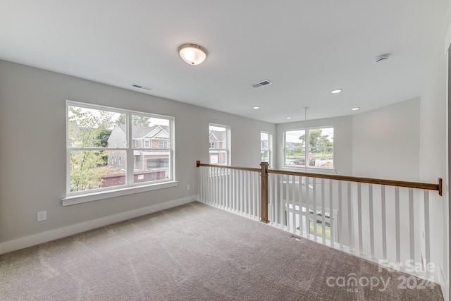 empty room featuring carpet flooring