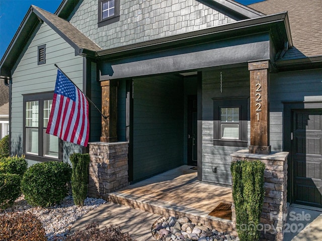 doorway to property featuring covered porch