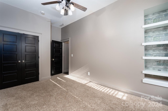 unfurnished bedroom with carpet flooring and ceiling fan