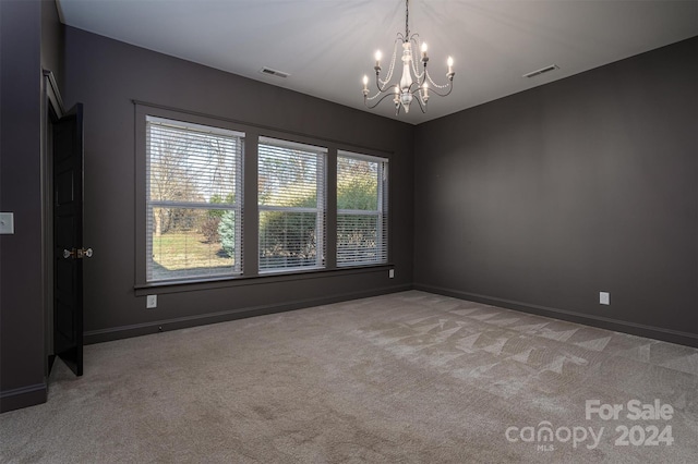 unfurnished room with plenty of natural light and light colored carpet