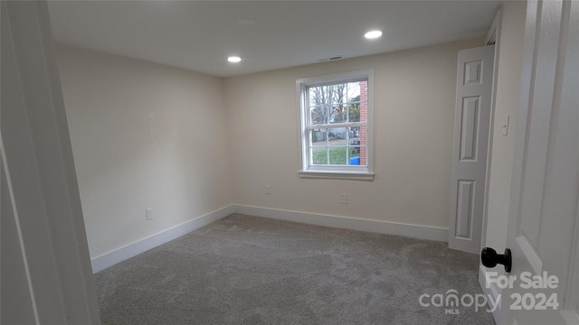 empty room featuring carpet flooring