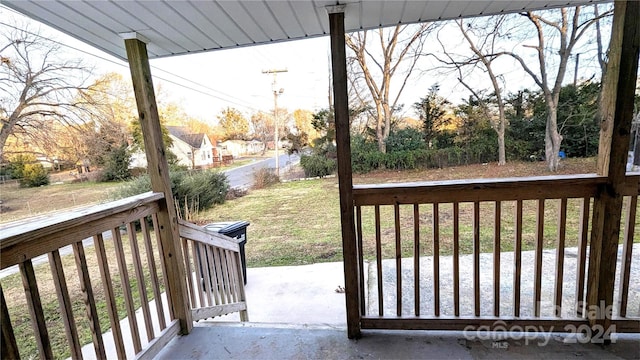 wooden deck featuring a yard