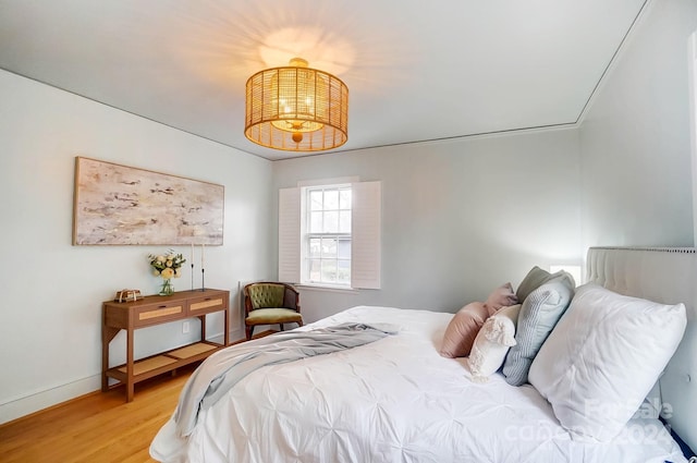 bedroom with wood-type flooring