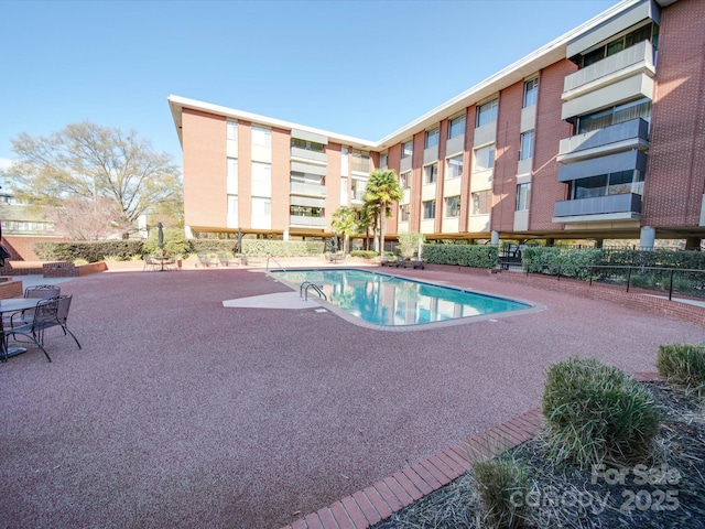 pool with a patio area