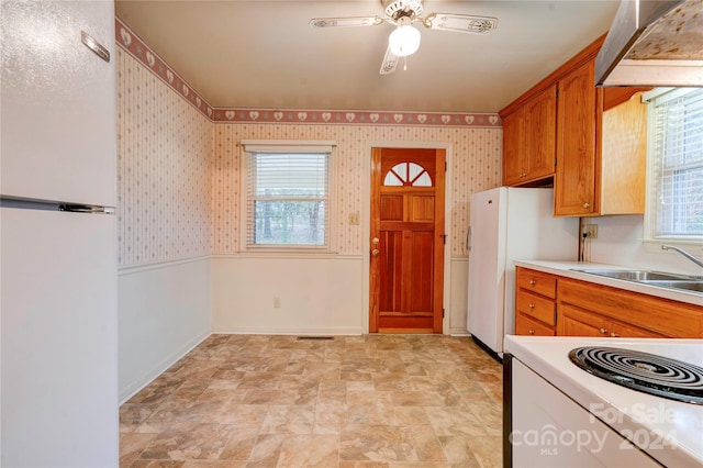 kitchen featuring ceiling fan, white appliances, and sink