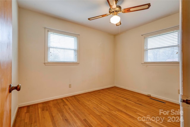 unfurnished room with light hardwood / wood-style flooring and ceiling fan