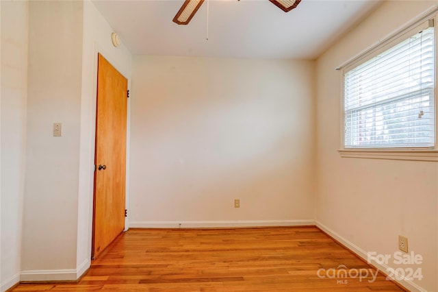 spare room with ceiling fan and light hardwood / wood-style flooring