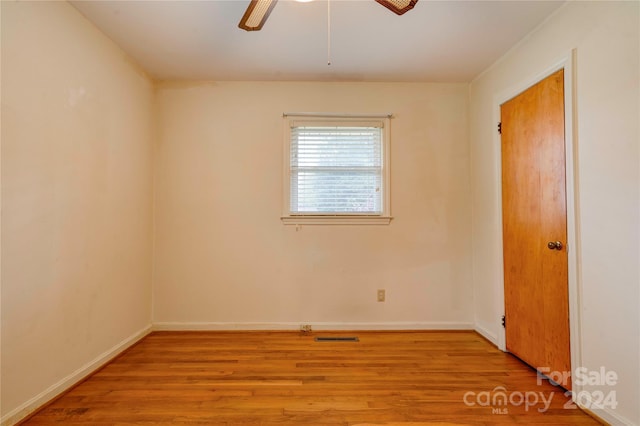 unfurnished room with ceiling fan and light hardwood / wood-style floors