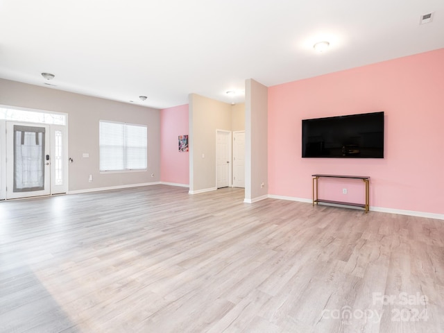 unfurnished living room with light hardwood / wood-style floors