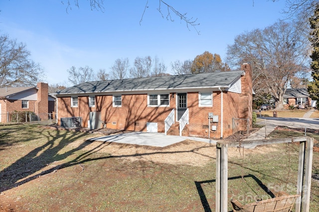 view of front of house featuring a front yard and a patio