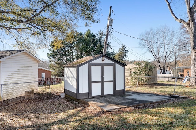 view of outdoor structure featuring a lawn