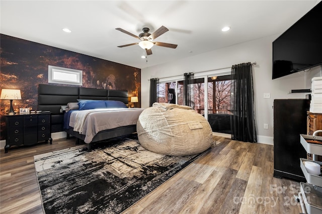 bedroom with ceiling fan and wood-type flooring