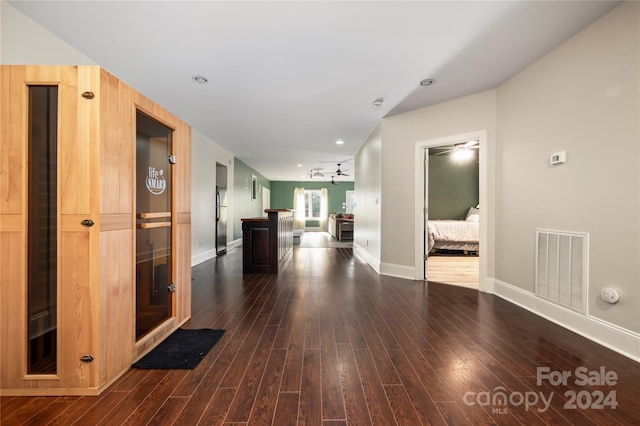 hallway with dark hardwood / wood-style floors