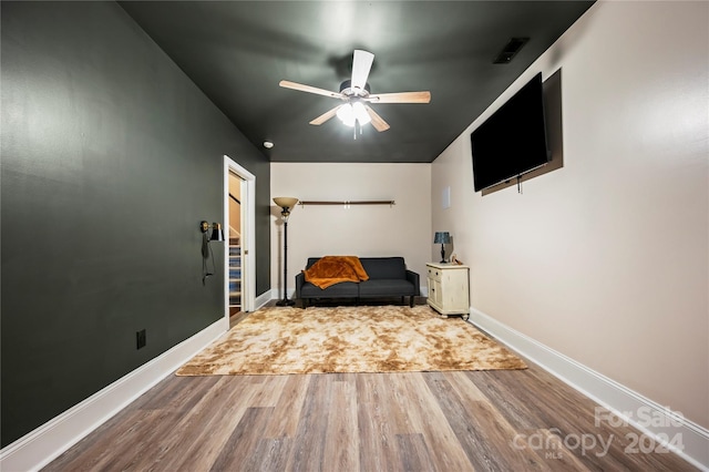 unfurnished bedroom featuring hardwood / wood-style flooring and ceiling fan