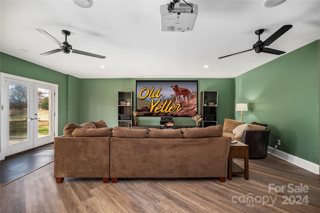 living room with french doors, ceiling fan, and wood-type flooring