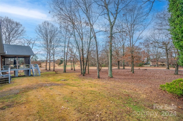 view of yard featuring a sunroom