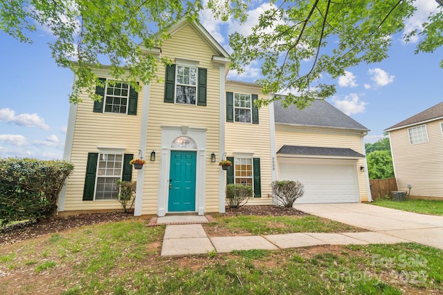 9509 Green Apple Dr, Charlotte, NC 28215 - view of front facade with cooling unit, driveway, roof with shingles, an attached garage, and fence