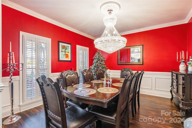 dining space featuring an inviting chandelier, dark wood-type flooring, and ornamental molding