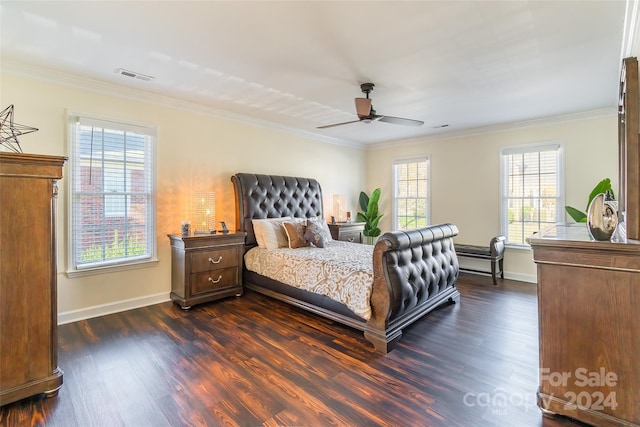 bedroom with ceiling fan, dark hardwood / wood-style flooring, ornamental molding, and multiple windows