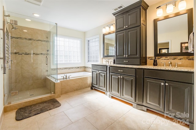 bathroom with vanity, tile patterned floors, and independent shower and bath