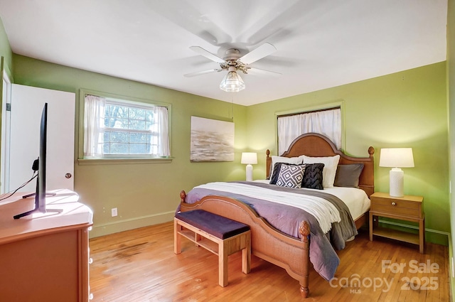 bedroom featuring light wood-type flooring and ceiling fan