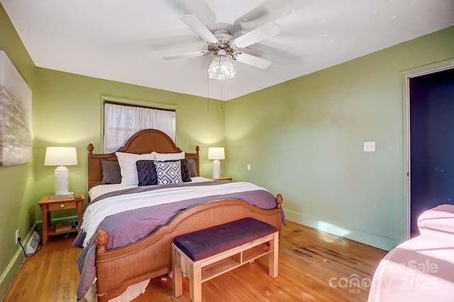 bedroom featuring ceiling fan and wood-type flooring