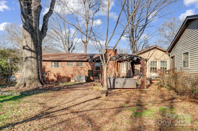 back of property with central AC unit