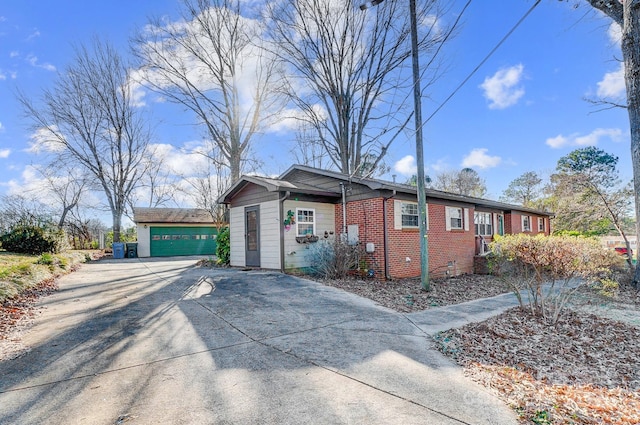 view of side of property with an outbuilding and a garage