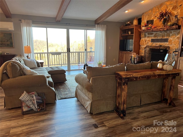 living room with beam ceiling, a fireplace, dark hardwood / wood-style flooring, and a wall unit AC