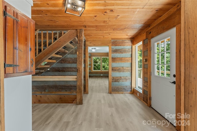 interior space featuring light hardwood / wood-style floors and wood ceiling