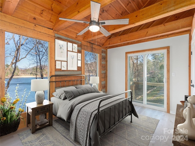 bedroom featuring access to exterior, wood ceiling, ceiling fan, light hardwood / wood-style flooring, and vaulted ceiling with beams