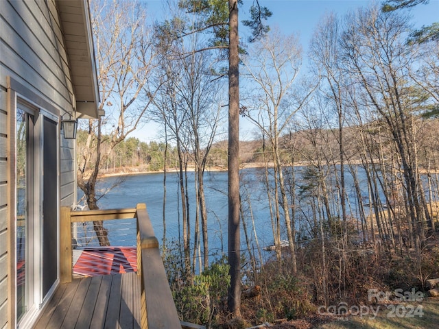 wooden deck featuring a water view