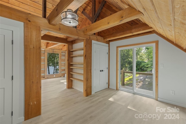 interior space with lofted ceiling with beams, light hardwood / wood-style flooring, and wooden ceiling