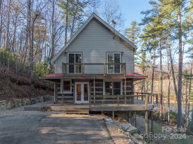 view of front of property featuring french doors and a deck