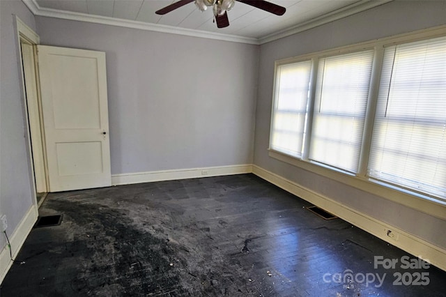 spare room with crown molding and ceiling fan